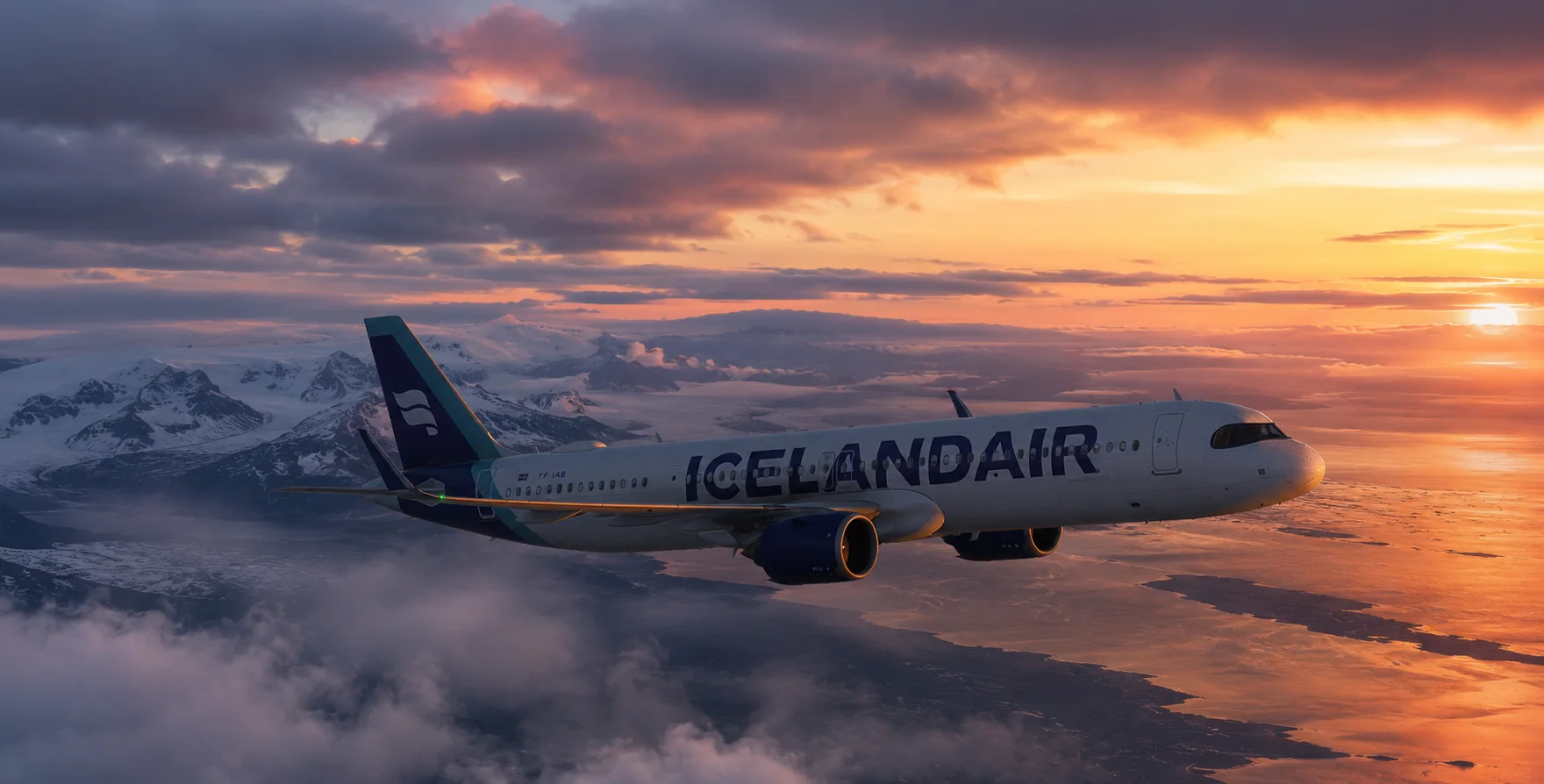 Icelandair aircraft flying above Iceland at sunset